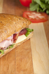 cropped ham sandwich in kitchen table