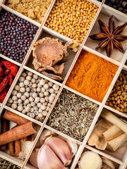 Assortment of spices food cooking ingredients in wooden box set