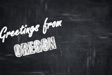 Chalkboard background with chalk letters: Greetings from oregon