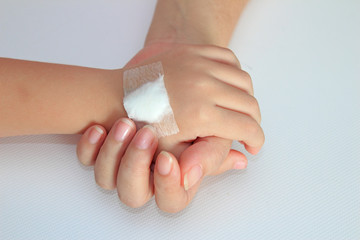 The mother gives the child's hand