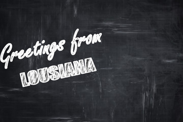 Chalkboard background with chalk letters: Greetings from lousian