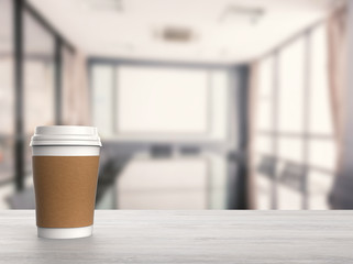 blank paper coffee cup with office background