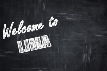 Chalkboard background with chalk letters: Welcome to lima