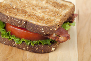 cropped image of bacon sandwich