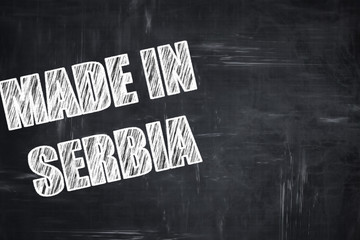 Chalkboard background with chalk letters: Made in serbia
