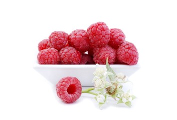 Raspberry. Sweet raspberries isolated on white background. Raspberries in white bowl. 