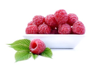 Raspberry. Sweet raspberries isolated on white background. Raspberries in white bowl. 