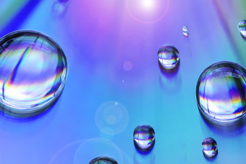 Macro of water drops on multicolor background