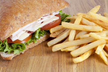 ham sandwich with fried potato fries