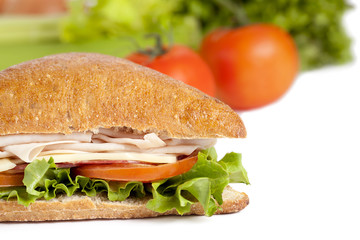 cropped image of ham sandwich on white