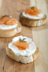 smoked salmon with cream cheese on piece of bread