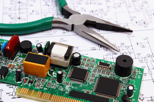 Printed circuit board and precision tools on diagram of electronics, technology