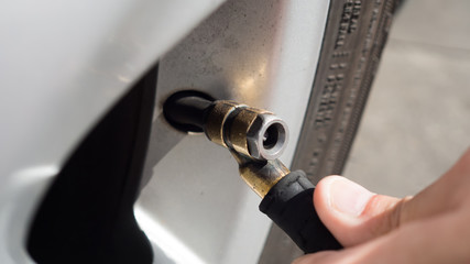 Filling air tire.