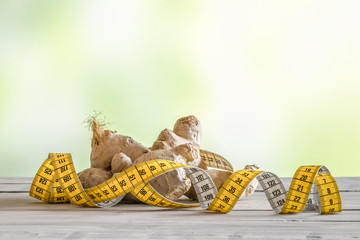 Raw ginger with measure tape