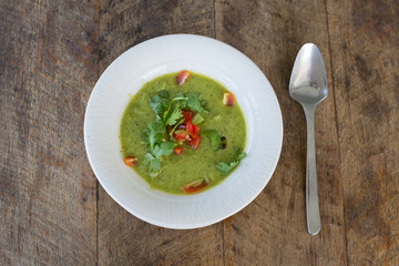 Soup gazpacho on wooden table, close up