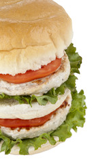 tall burger with chicken patty and veggies