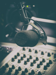 Microphone and mixing panel in radio studio. © M-Production