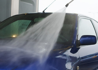 Obraz premium Car wash using high pressure water jet.