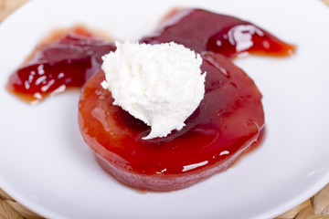 Turkish Speciel Traditional Quince Dessert with Cream on Burlap Background
