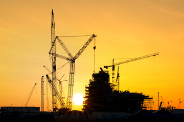 Silhouette of construction site in sunset time