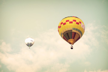 Hot air balloon on sun sky with cloud, vintage and retro filter effect style