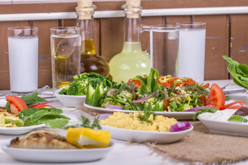 Turkish and Greek traditional rustic dinner table with raki, ouzo