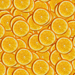 Abstract background with slices of fresh orange. Seamless pattern for a design. Close-up. Studio photography