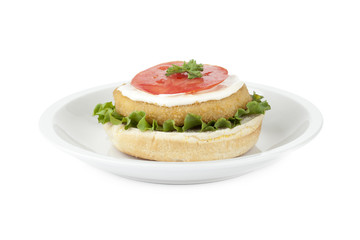 a plate with uncover chicken hamburger