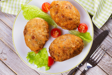 Scotch Eggs Served with Tomato Cherry and Salad on White Plate