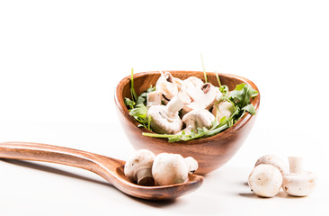 Fresh mushrooms champignons in bowl isolated on white