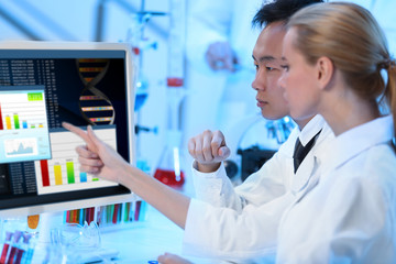 Young medical technicians working in laboratory