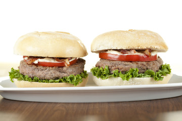 round plate with two chicken burgers
