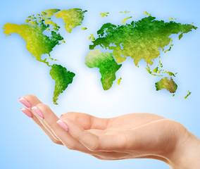 Woman holding map of world on her hand on abstract blue background