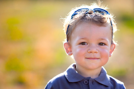 happy smiling child outdoor in a garden