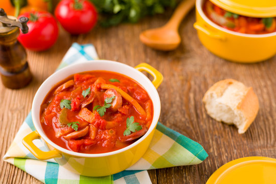 Delicious letcho with fresh vegetables, served in a yellow pot w