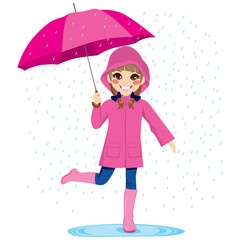 Cute little girl under the rain with pink raincoat and umbrella