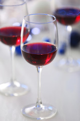 Wineglasses on blue blurred lights background