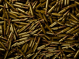 Background of pile of polished rifle bullets