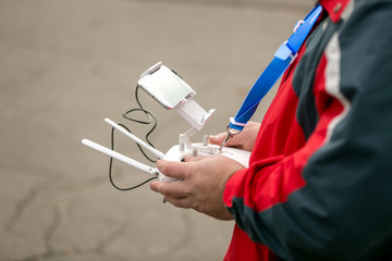 Closeup of pilot holding drone remote control