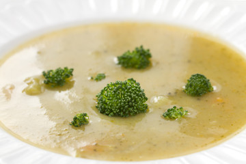 vegetable soup with broccoli on white dish