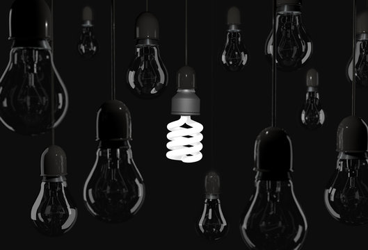 Energy saving bulb lighting black room with incandescent bulb ha