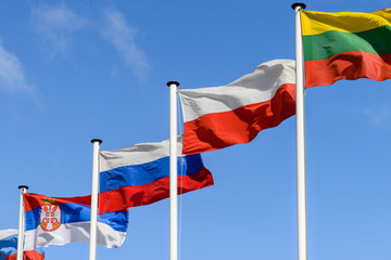 Flag of Russia, Poland and Lithuania on the background of the sk
