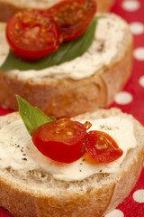 Fototapeta na wymiar tasty bread with butter spread and tomato slices