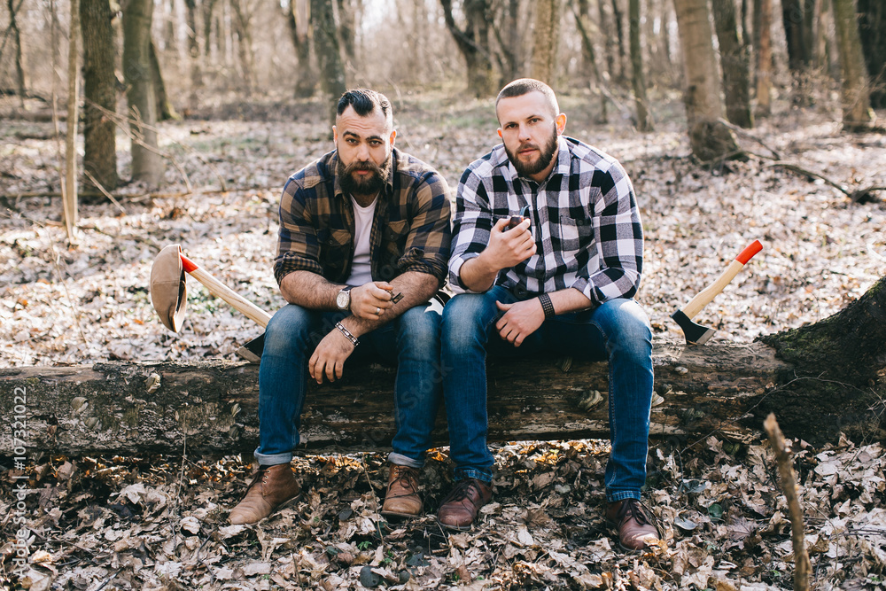 Wall mural Two bearded men in the wood