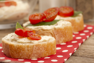 Fototapeta na wymiar slices of bread with butter and tomatoes