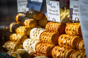 Traditional polish smoked cheese oscypek on outdoor market in Za