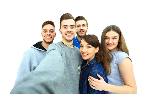 Group of happy young teenager students taking selfie photo isolated on white background