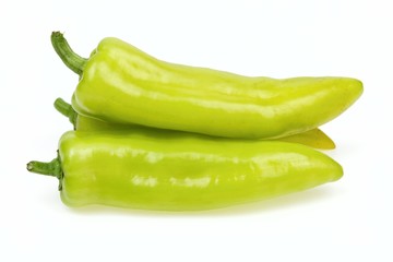 Pointy green peppers, on white background.