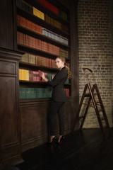 Confident business woman in the classical library