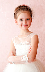 Adorable smiling little girl in white princess dress © svetamart